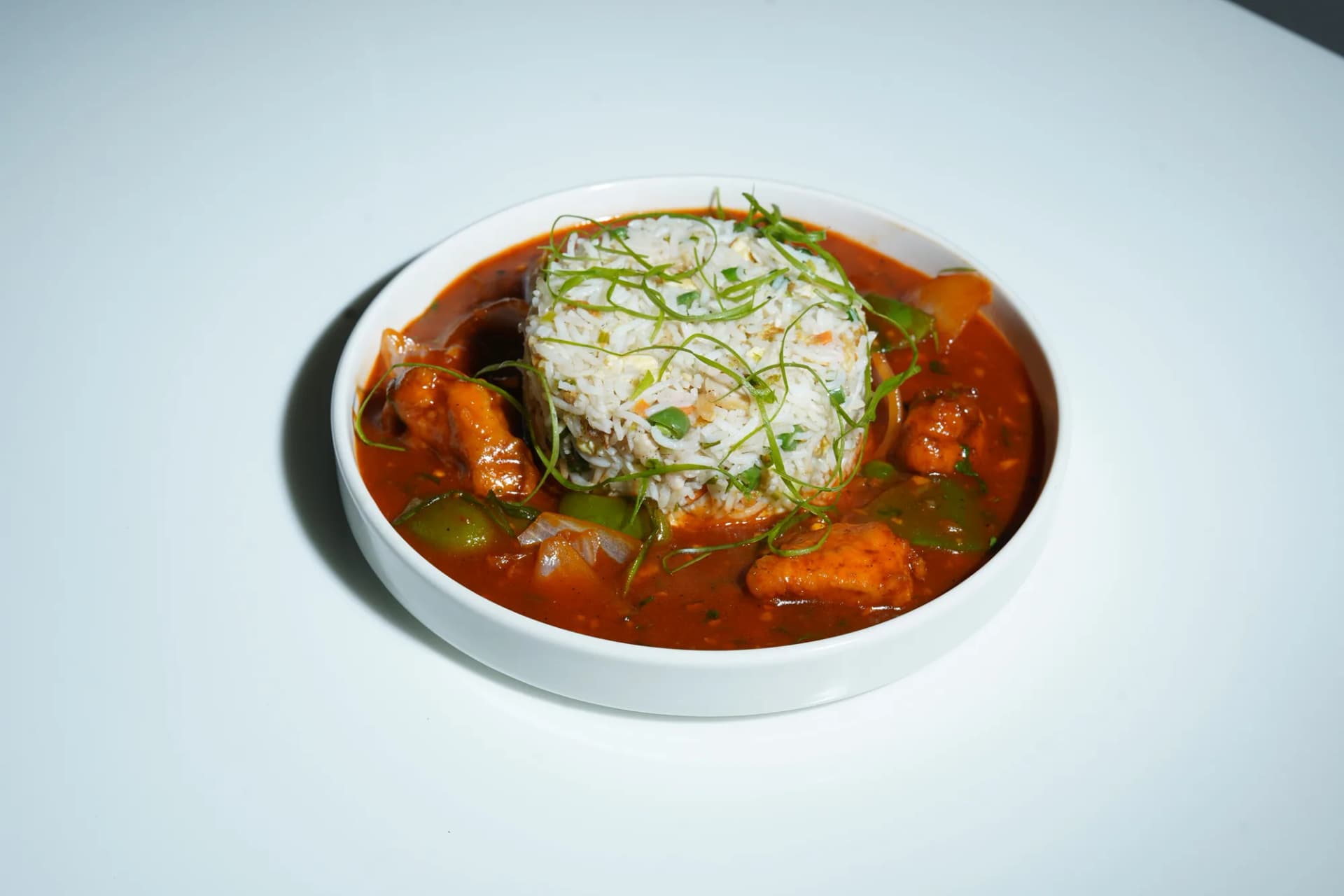 Fragrant rice served with a bowl of restaurant gravy